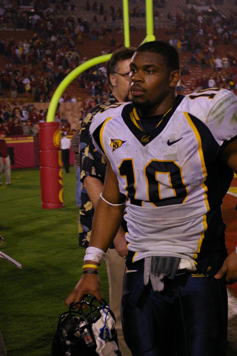 A very dejected Desmond Bishop walking off the field