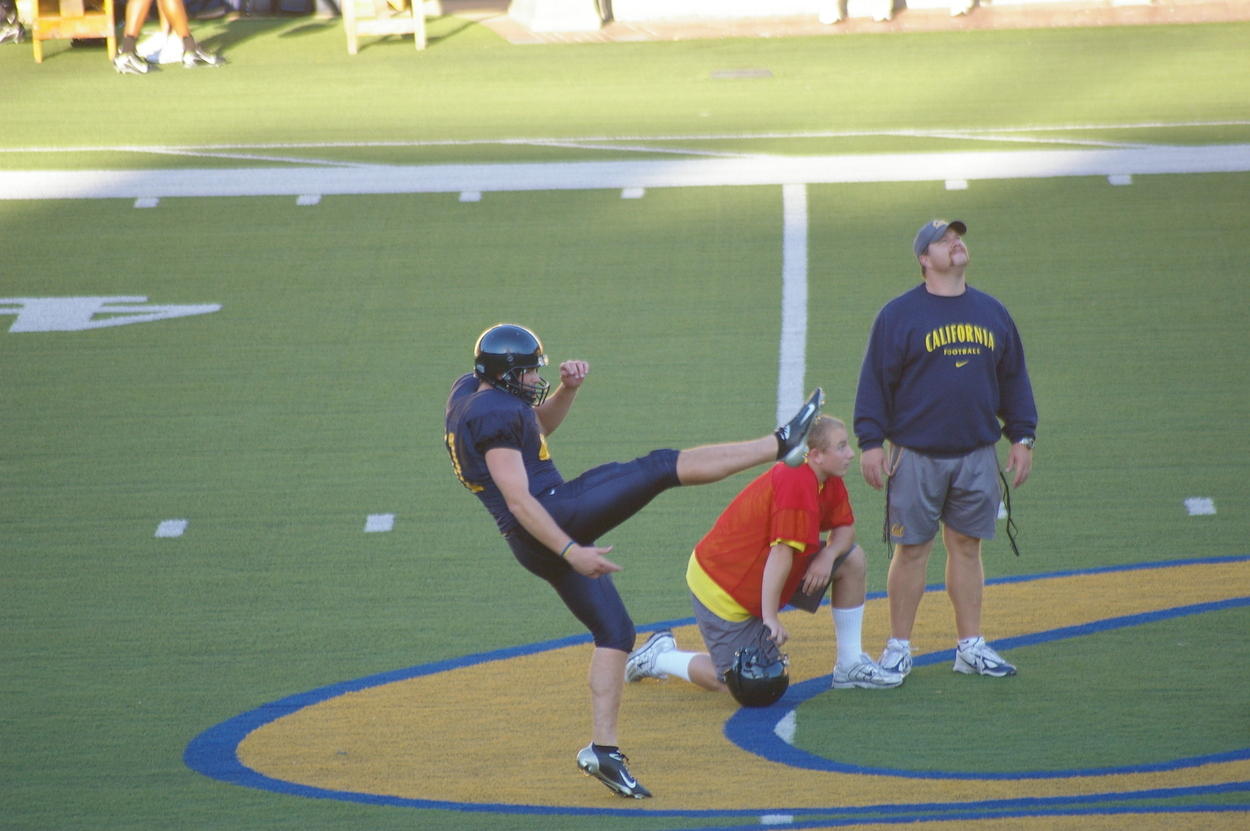 Larson practicing punting