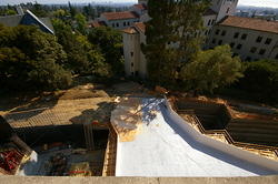 Construction towards the I-House with the exit of the raised walkwayshow going over the excavation